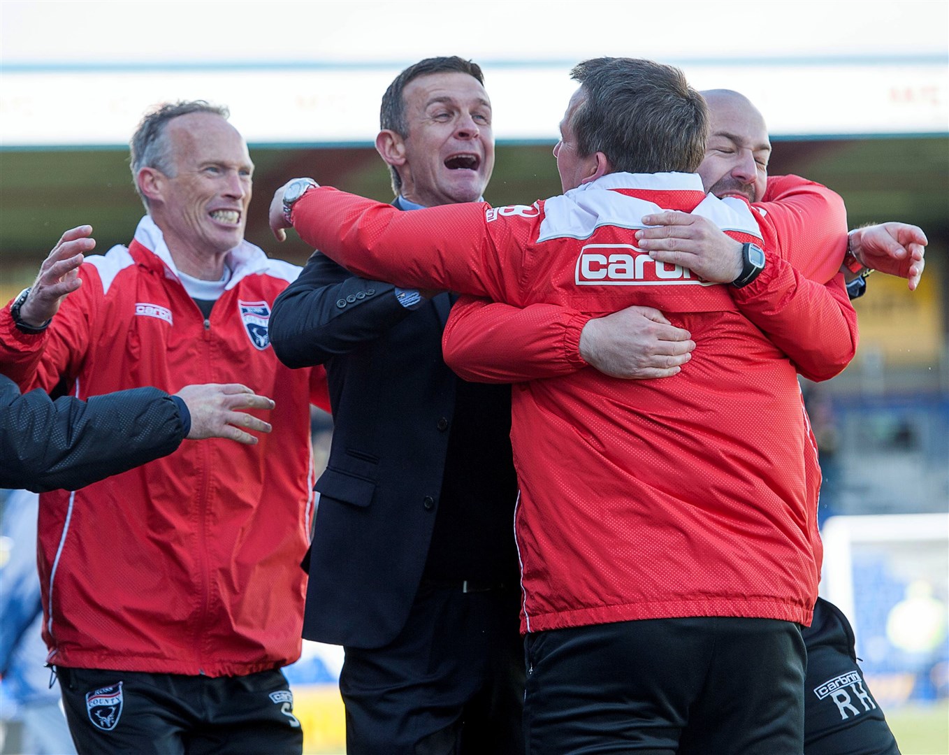 Ross County manager Jim McIntyre celebrates with assistant Billy Dodds at the final whistle of the win over Hamilton. Picture: Ken Macpherson