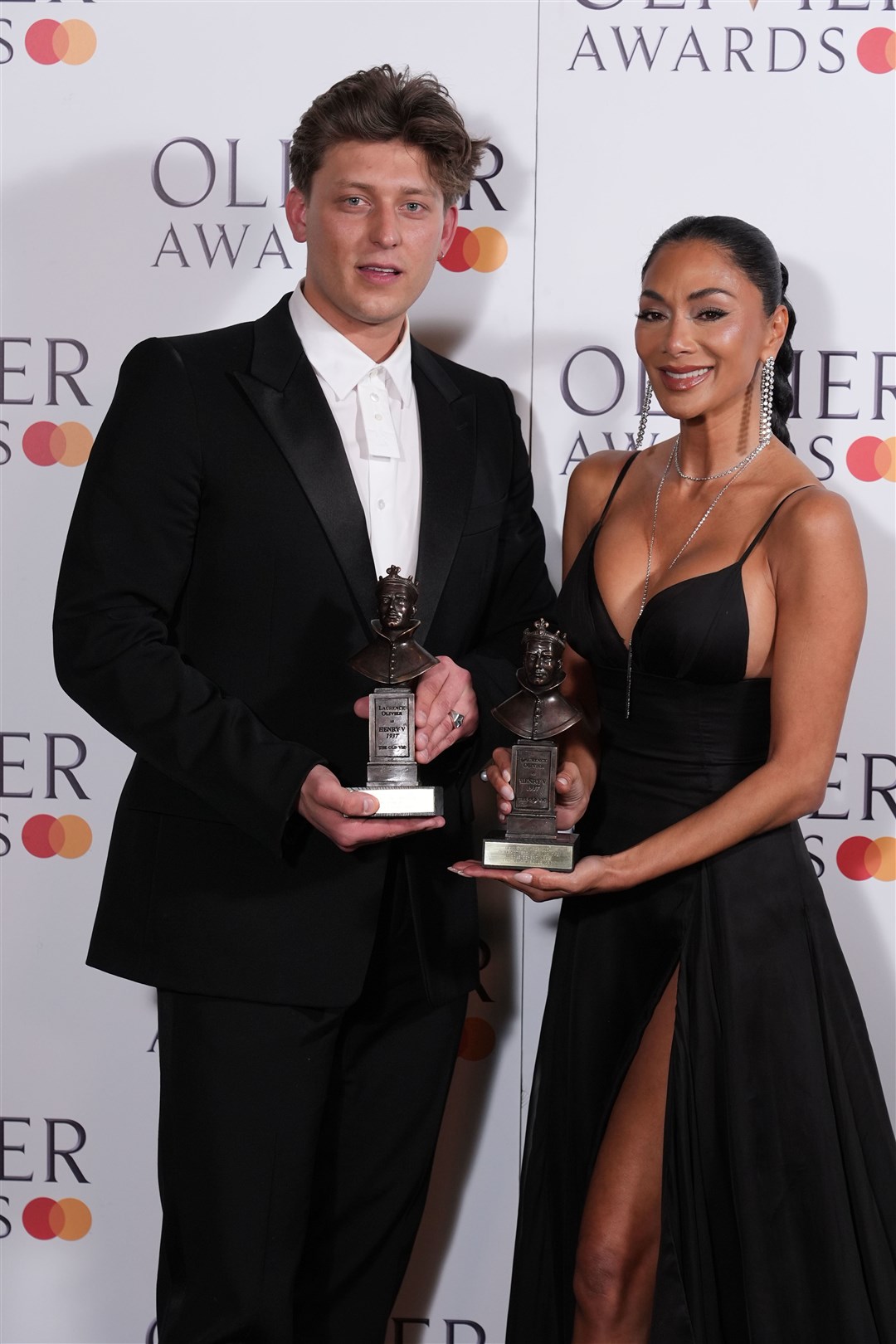 Tom Francis and Nicole Scherzinger with their awards (Ian West/PA)